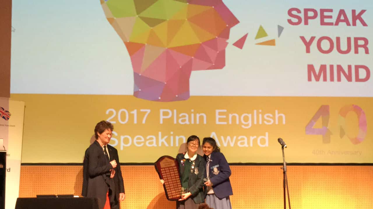 Emily Kim receiving her award.