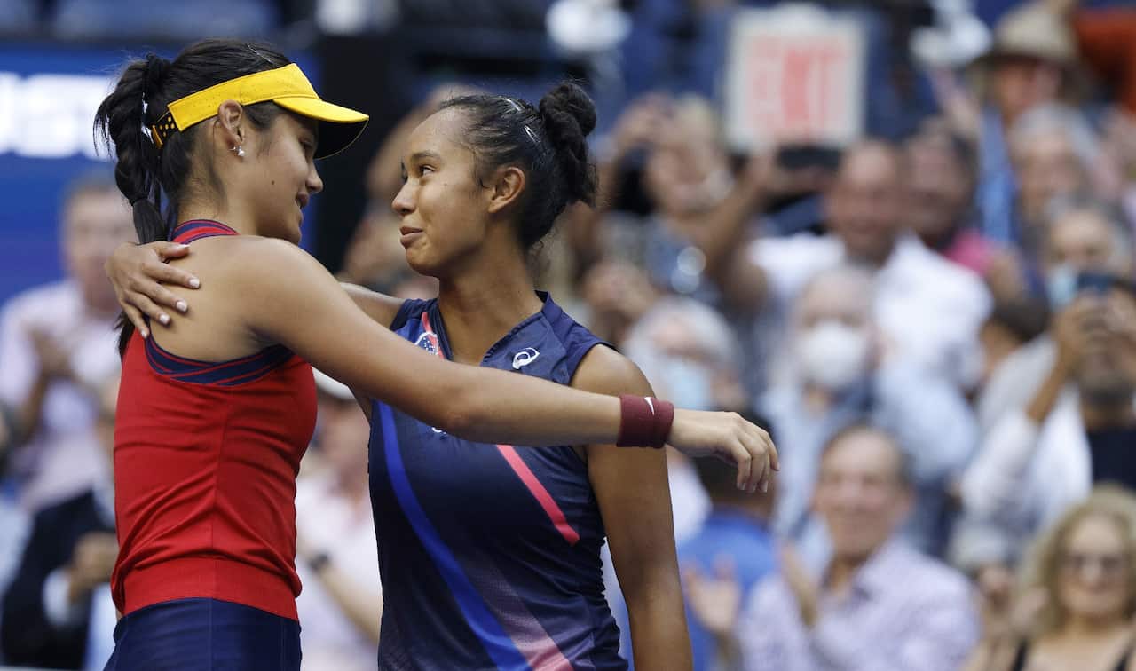 Leylah Fernandez hugs Emma Raducanu after Raducanu defeated Fernandez in the women's singles final of the US Open tennis championships.