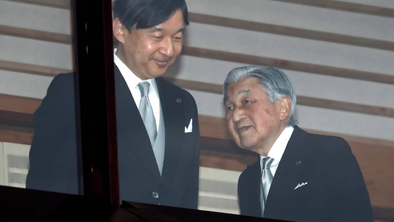 Japan's Emperor Akihito, right, accompanied by Crown Prince Naruhito.