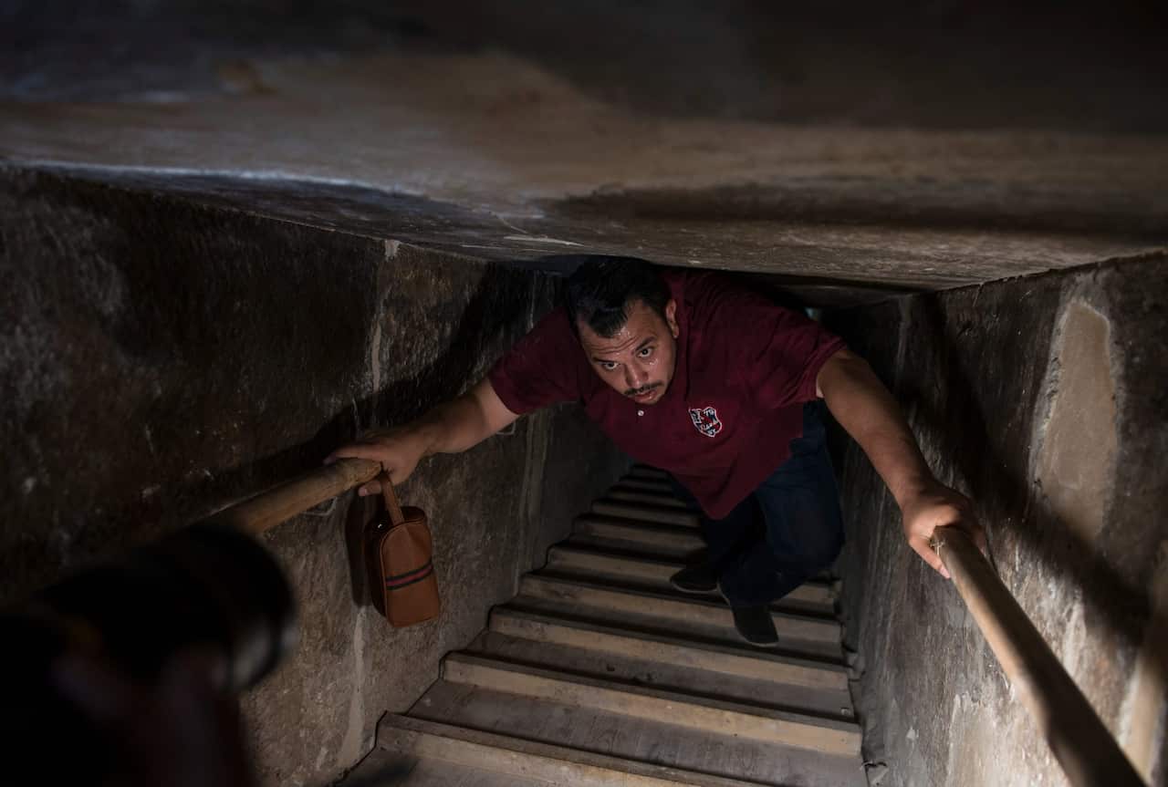 A man walks through a passage inside the Bent Pyramid of Sneferu that was reopened after restoration work, in Dahshur, some 40kms south of Cairo, Egypt