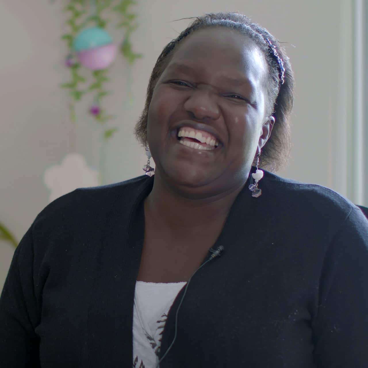 Esther Simbi smiles at the camera