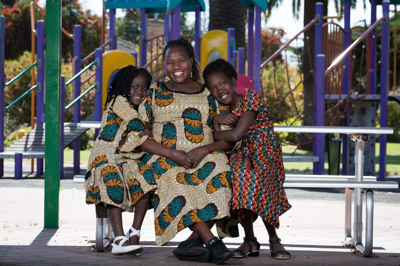 Disability advocate Esther Simbi with her two children in Adelaide.