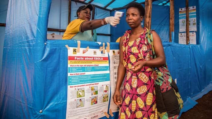 In this photo provided by the International Rescue Committee, Congolese refugees are screened for Ebola symptoms at the IRC triage facility in the Kyaka II refugee settlement in Kyegegwa District in western Uganda, Thursday, June 13, 2019. The Congolese p