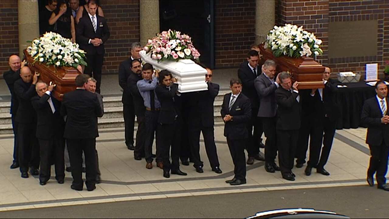 Mourners gathered at St Mary's Catholic Church in Concord to farewell Lars, Vivian and Annabelle Falkholt.