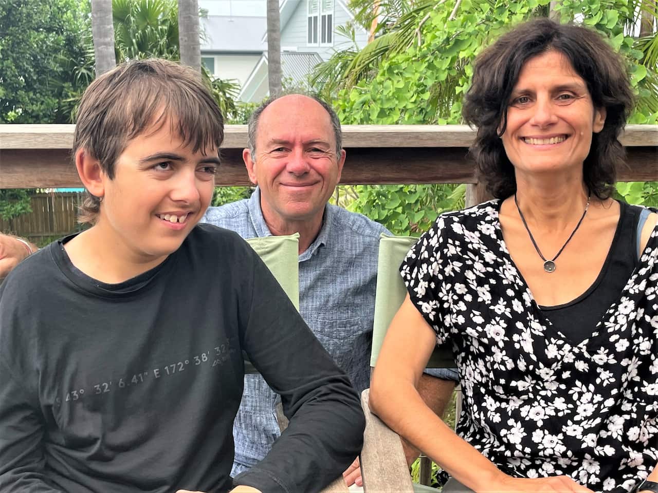 Luca Weber (left) at home with his parents Lars and Susanna. 