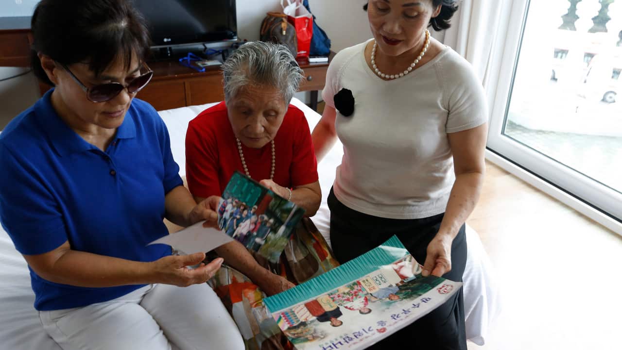 A South Korean separated familie Lee Geum-sum (91,C) waits with her family to go to North Korea to meet their North Korean family.