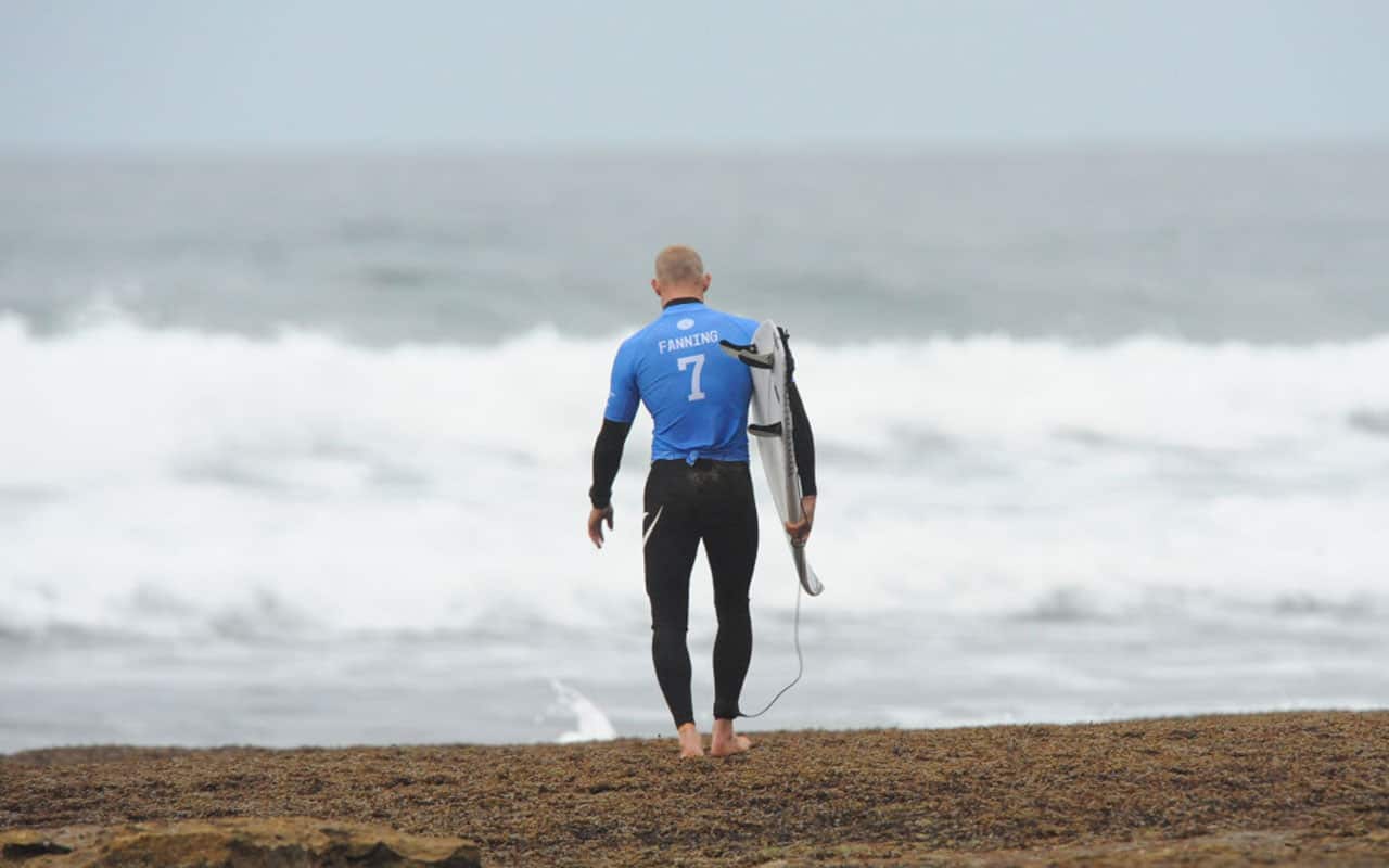 Mick Fanning walks out to his first heat during a Rip Curl Pro event. 
