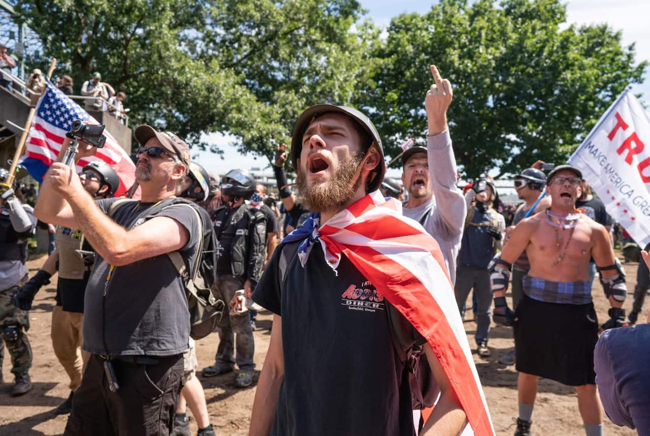 Far right protesters jeer at members of Antifa during protests organized by the far right group the Proud Boys