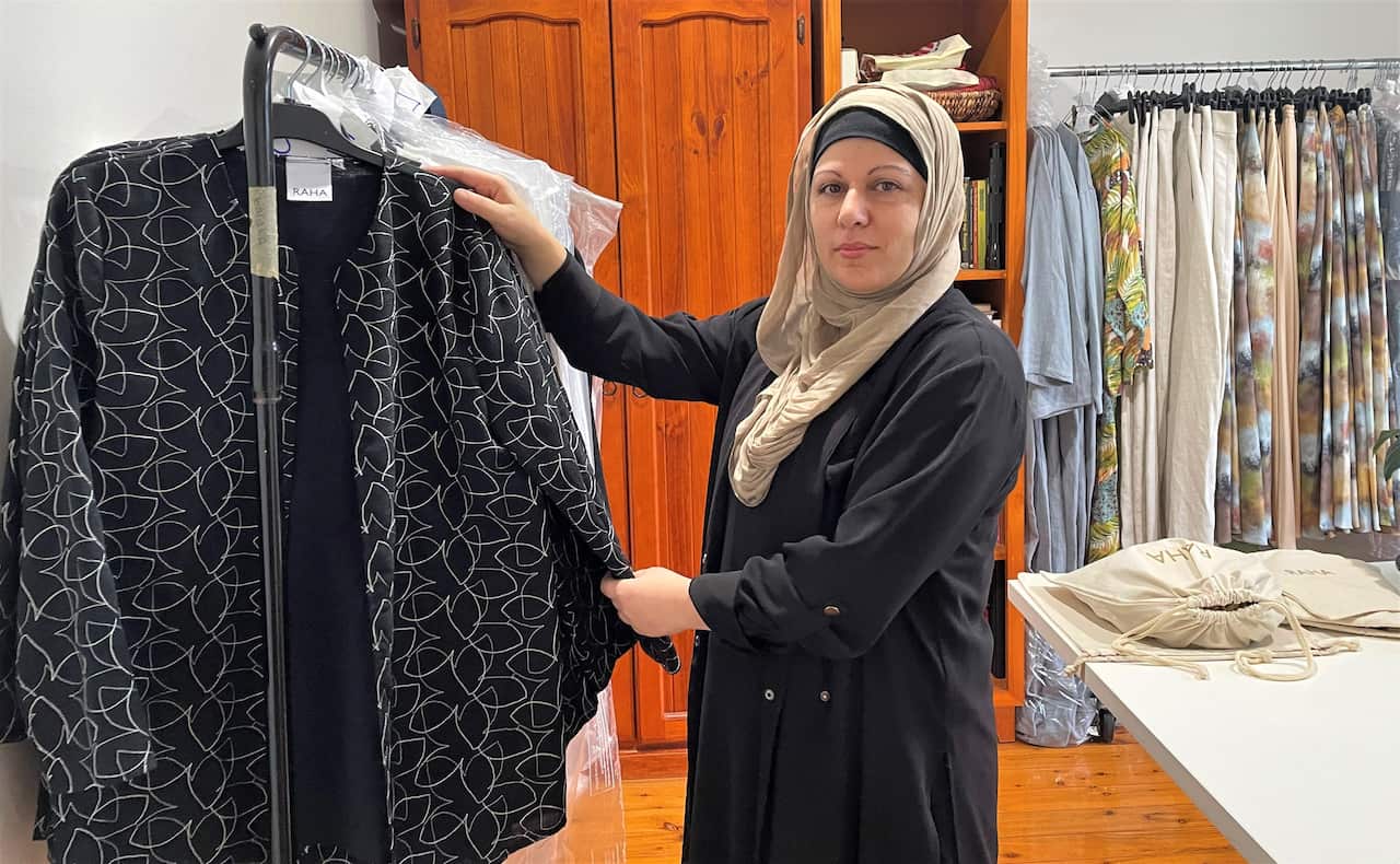 Eisha Saleh with some of her Eid pieces.