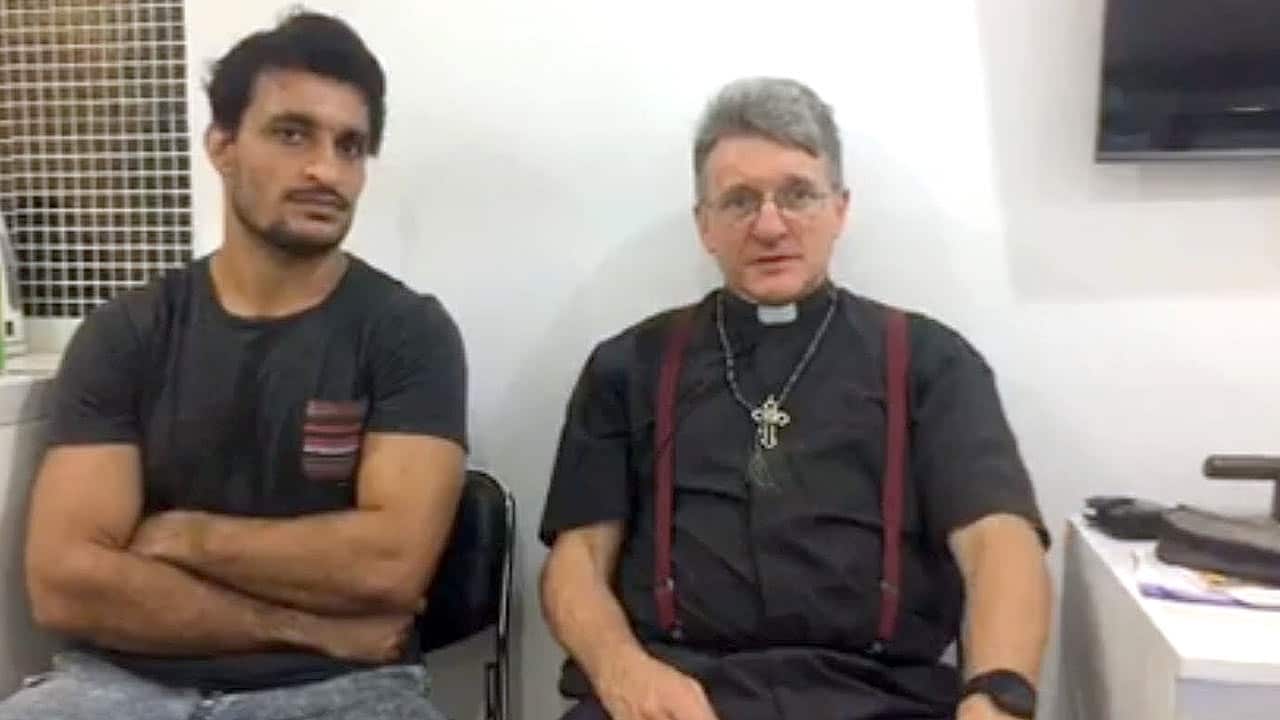 Staunch supporter Father Dave with Ezatullah Karkar.