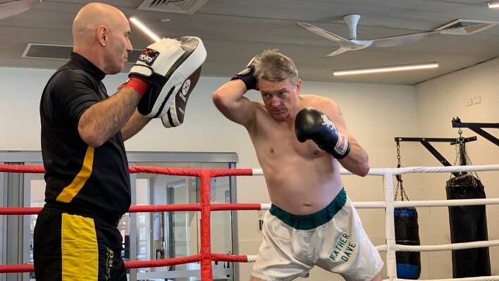 Father Dave Smith and his sparring partner.