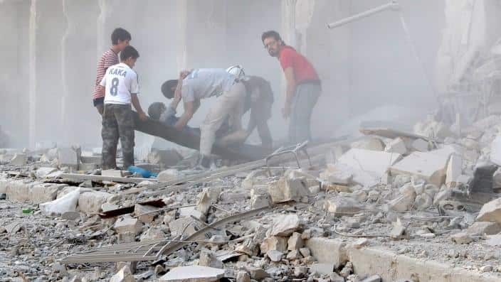 Casualties are evacuated after Syrian regime airstrikes hit Aleppo's opposition controlled Al-Ansari town, Syria