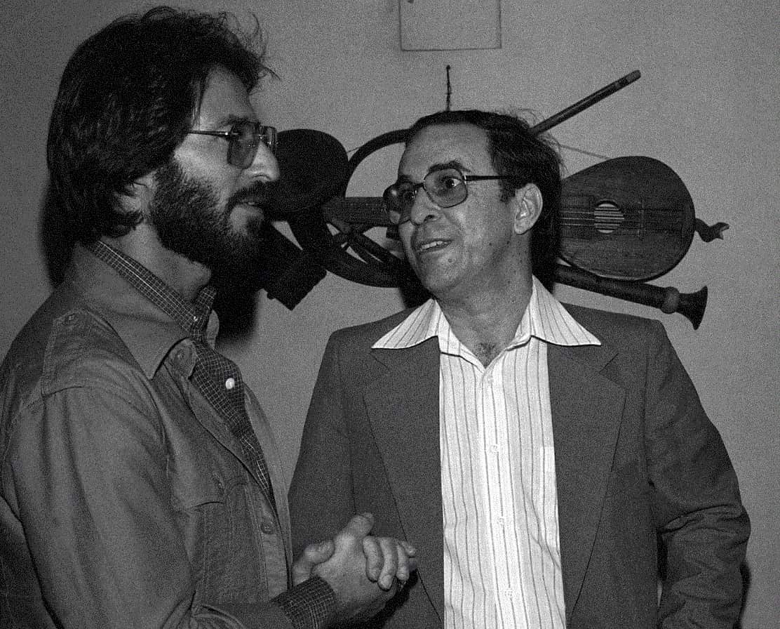 In this July 1978 file photo, Brazilian Joao Gilberto, right, chats backstage with a fan at the Newport Jazz Festival