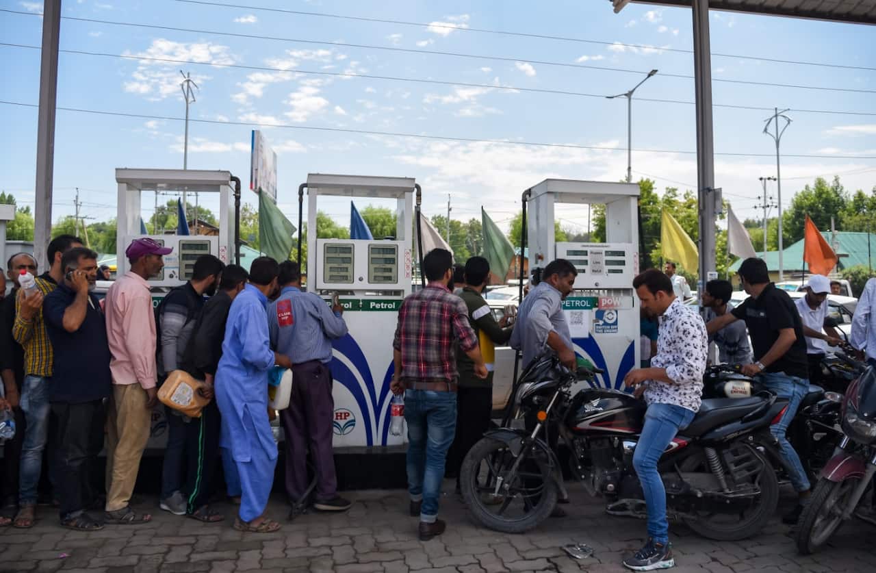 Kashmiri residents in a queue at a fuel station in Srinagar. Fear and confusion have gripped residents in India administered Kashmir 