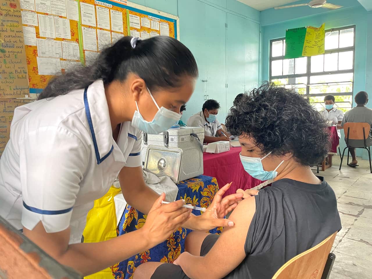 Taia Ivini getting the COVID-19 vaccine at Nehru Primary School in Suva