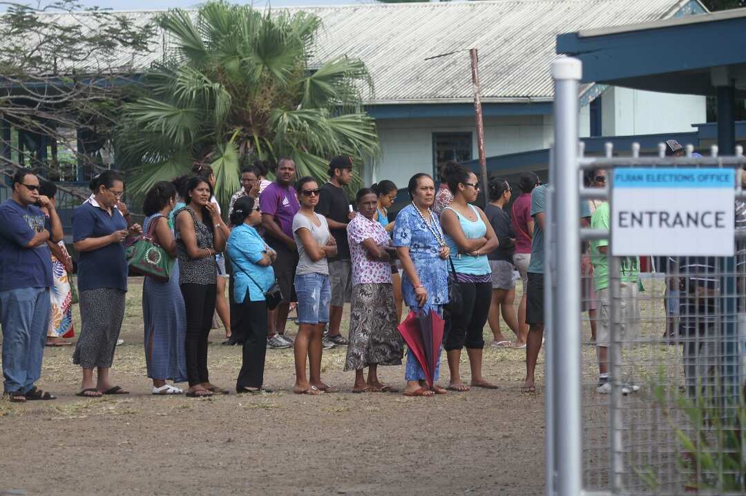 Fijian voters line up at a polling station in Suva.