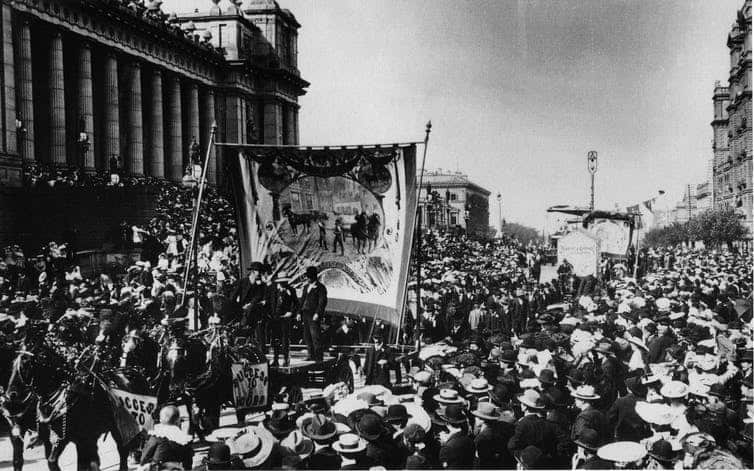 Workers marching for an eight-hour day outside Parliament House in Spring Street, Melbourne, circa 1900.