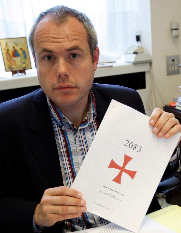 Belgian Flemish right-wing party member Tanguy Veys holds a copy of a manifesto sent to him and written by Anders Behring Breivik, who killed 76 people in twin attacks in Norway in 2011.