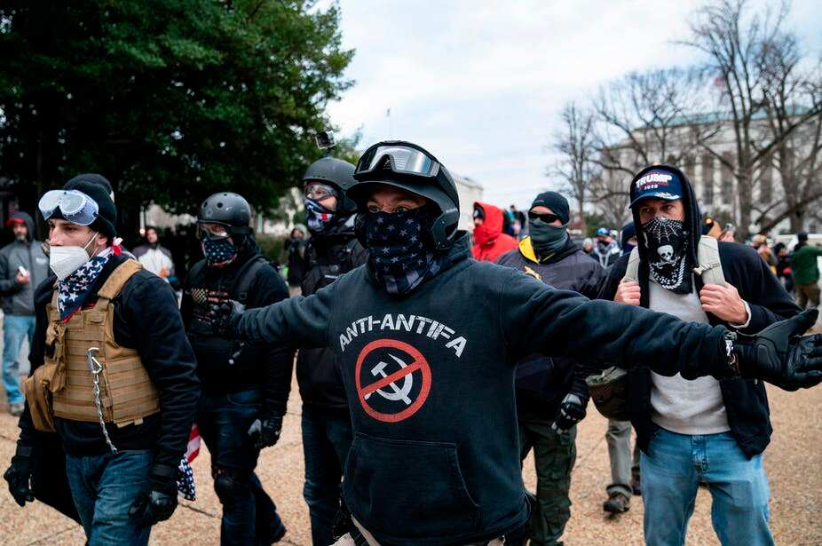 Protesters who claimed to be members of the far-right Proud Boys gather with other Trump supporters outside the U.S. Capitol on Jan. 6, 2021.