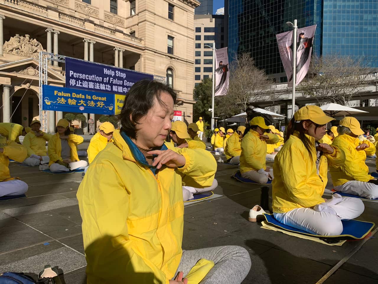 Falun Gong members practicing meditation at Circular Quay, Sydney. 