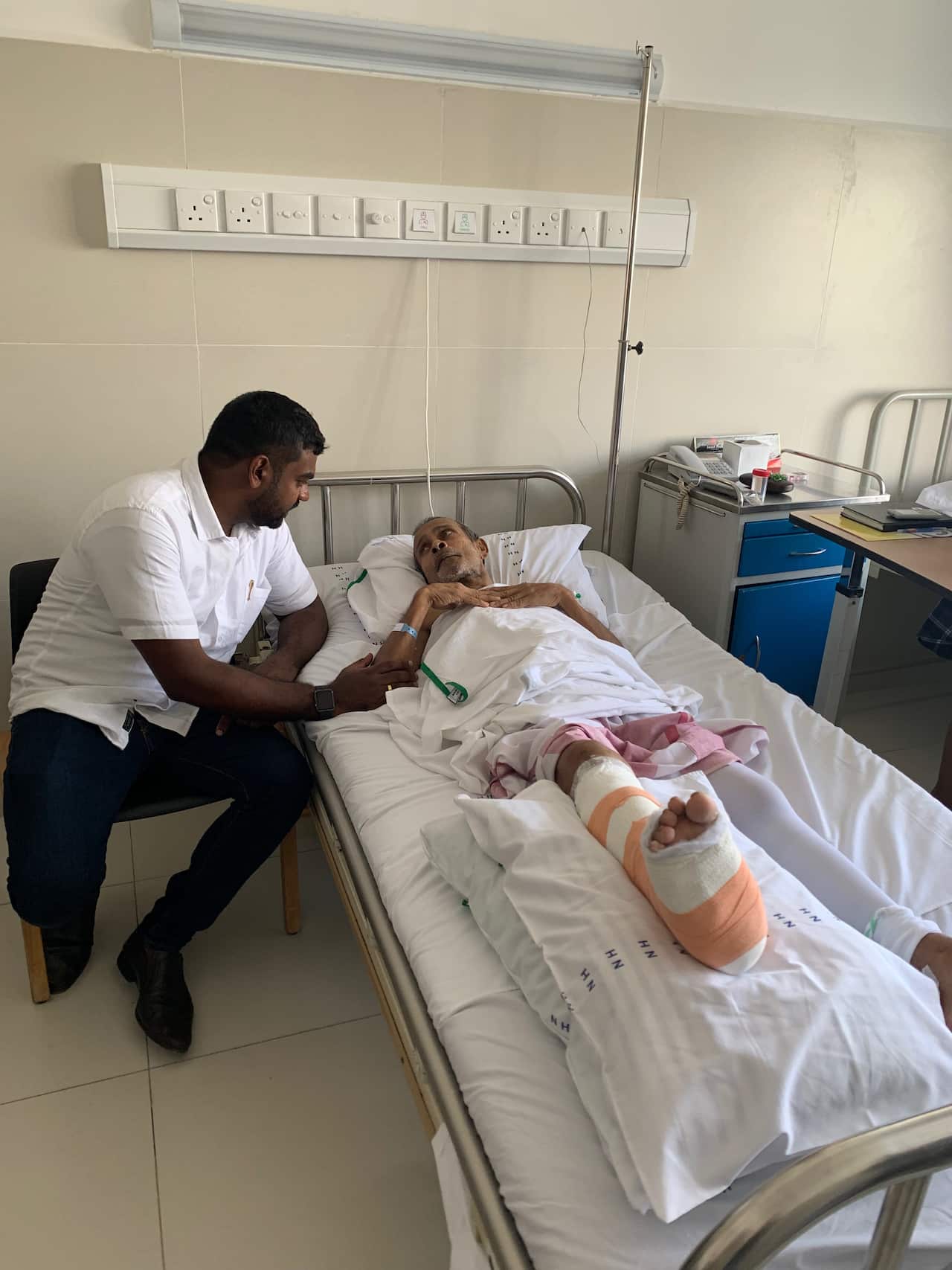 A patient recovering at the Nawaloka Hospital in Colombo. He sustained four fractures to his right tibia and fibula and has had four surgeries to date. 