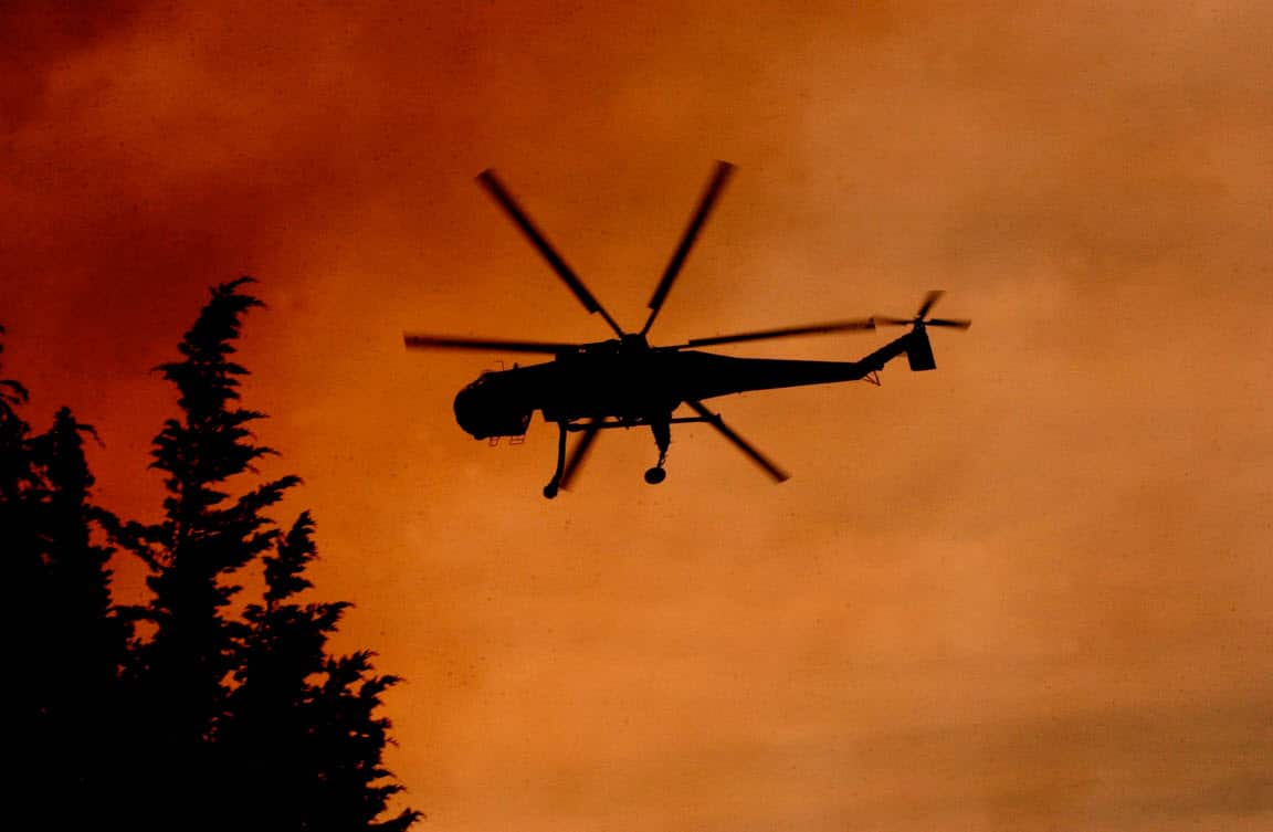 File image of a helitanker fighting a bushfire near Mittagong, NSW (AAP)