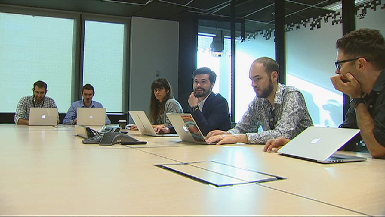 Flux members in a meeting.