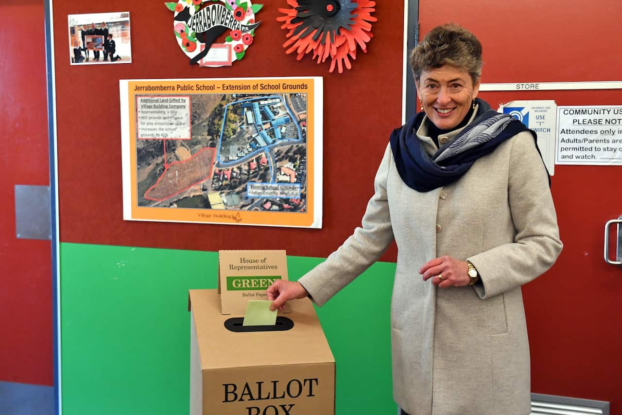 Liberal candidate for Eden-Monaro Fiona Kotvojs votes at Jerrabomberra Public School polling station, north of Queanbeyan, NSW.