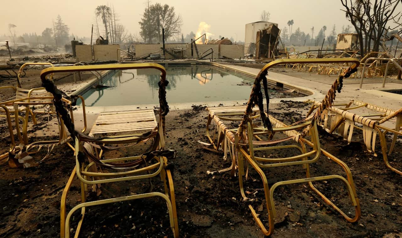 Fire burns from an open gas valve near the pool area at the Journey's End mobile home park on Monday, Oct. 9, 2017, in Santa Rosa, Calif.