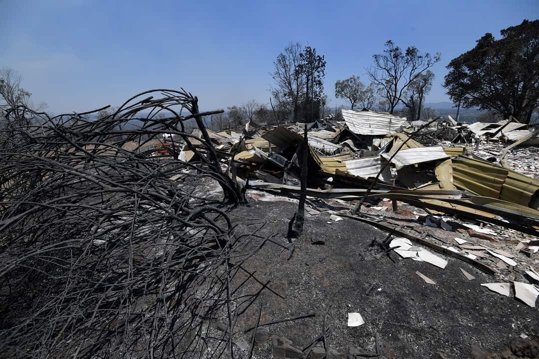 The burnt remains of a house destroyed in a bushfire seen in Kabra, Queensland, Thursday, November 29, 2018. Fire conditions in the area are severe with 140 fires burning around the state. (AAP Image/Dan Peled) NO ARCHIVING