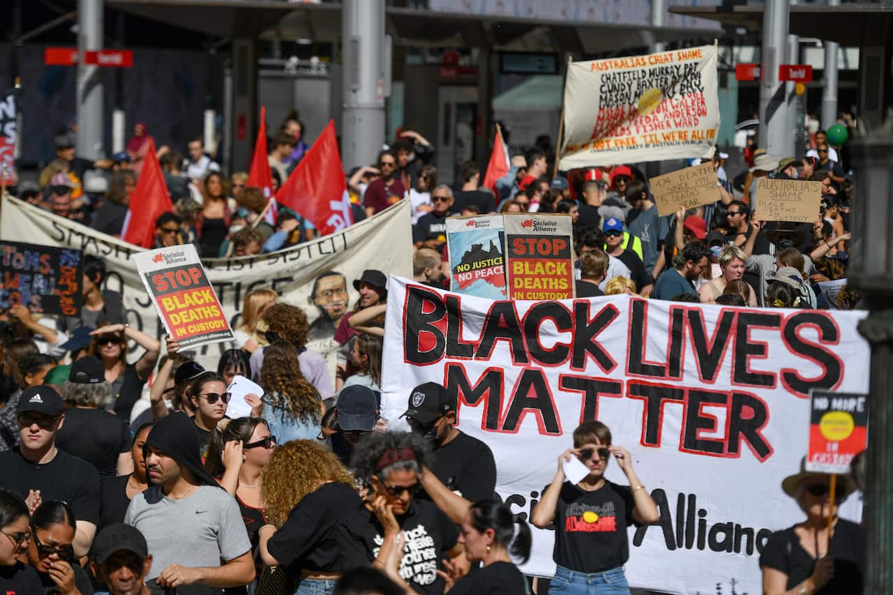 Protesters at a Black Deaths in Custody Rally at Town Hall in Sydney.
