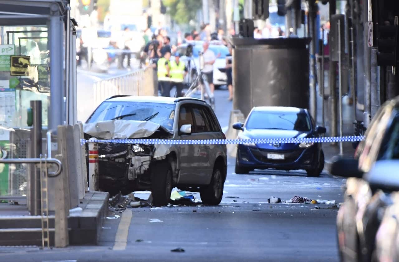 A damaged vehicle is seen at the scene of an incident on Flinders Street, in Melbourne, Thursday, December 21, 2017. 