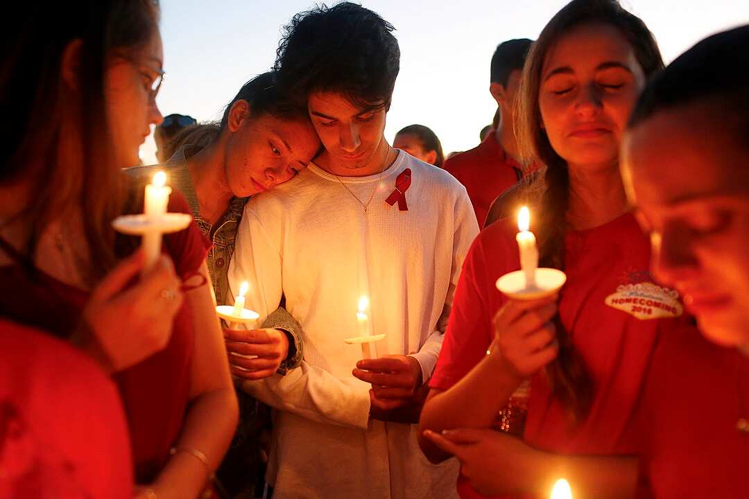 Students gather during a vigil at Pine Trails Park for the victims of the Wednesday shooting at Marjory Stoneman Douglas High School.