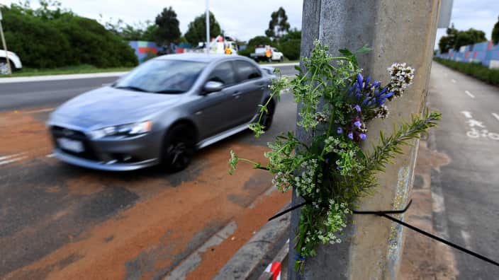 Flowers are laid at the site of the crash.