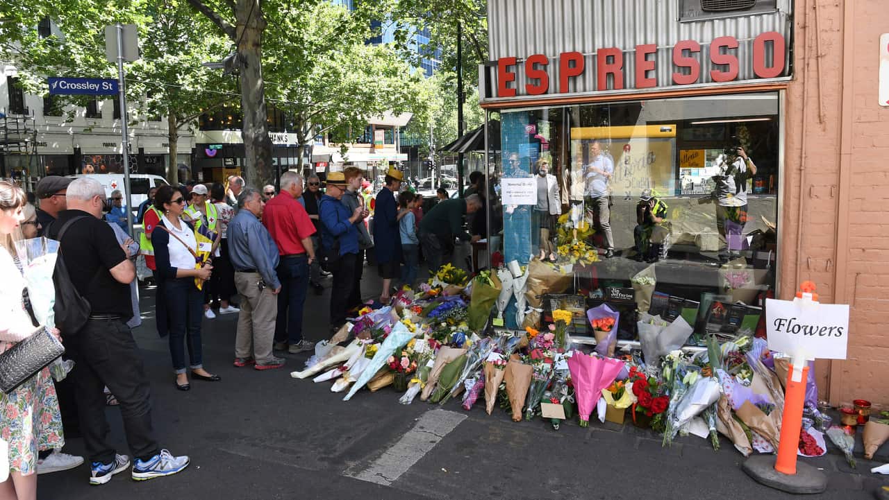 Mourners pay their respects to Sisto Malaspina, co-owner of Pellegrini's Espresso Bar.