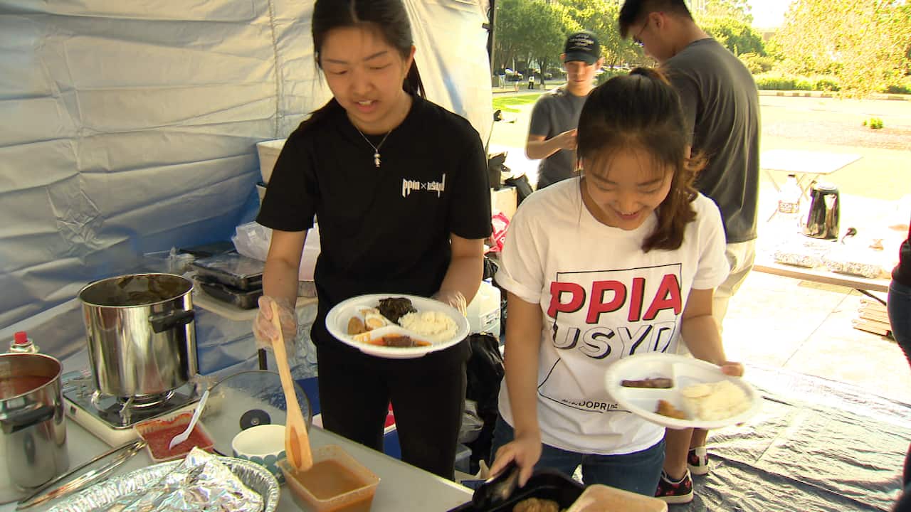 At an Asian Food Festival at the University of Sydney, Indonesian students  serve up  traditional fare from their homeland.  