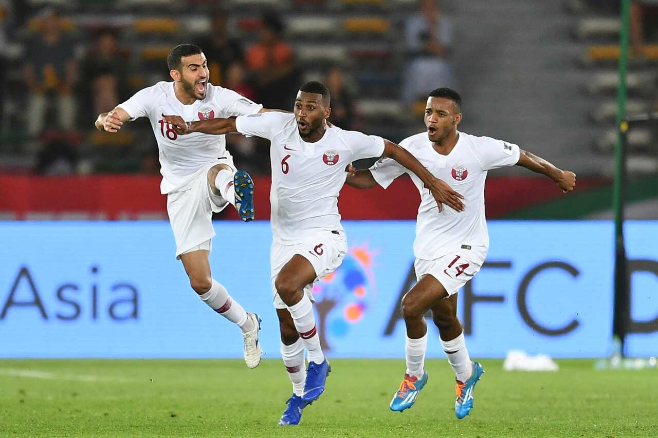 Qatar players in action against South Korea. 