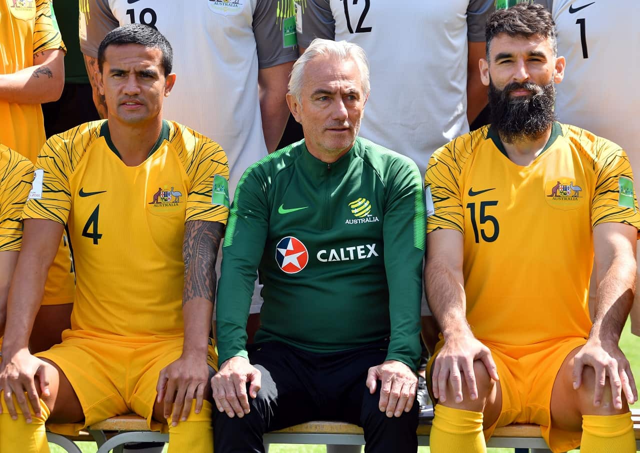 Australia's forward Tim Cahill (left) coach Bert van Marwijk and midfielder Mile Jedinak (right) pose on the sideline of a training session in Kazan.