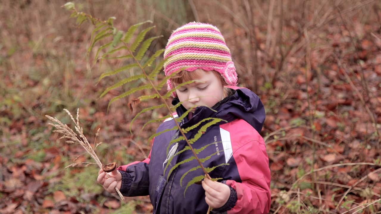 At home, four-year-old Nicola loves dressing up and playing with dolls, but outside she’s just as happy foraging for Christmas decorations. (Photo: Marianne Borowiec)