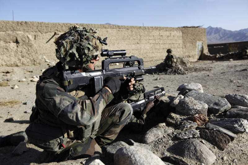 France says it will keep troops in Syria to combat IS. A Foreign Legion trooper is pictured fighting in Afghanistan.