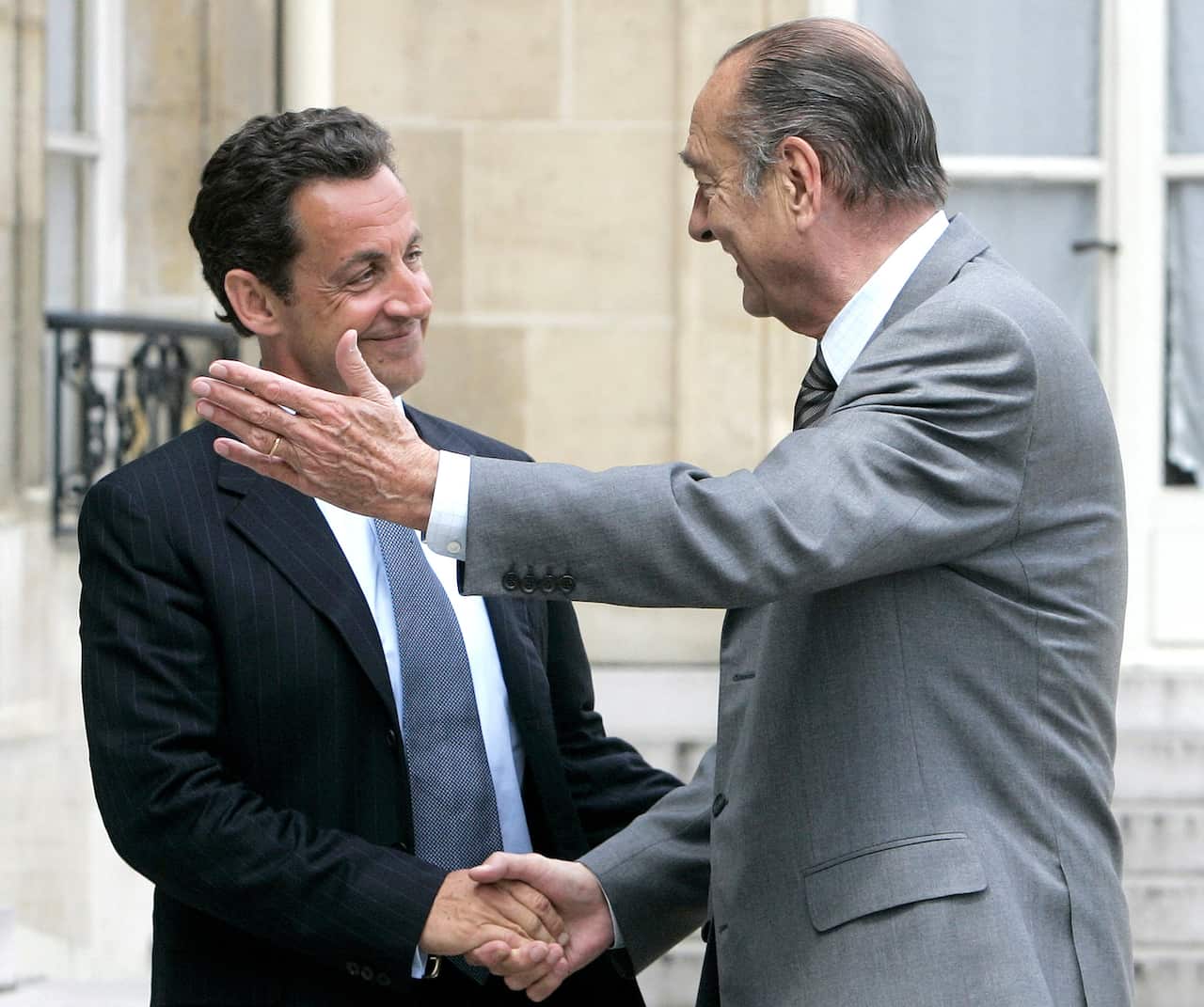 Outgoing French President Jacques Chirac, right, welcomes French President-elect Nicolas Sarkozy in 2007.