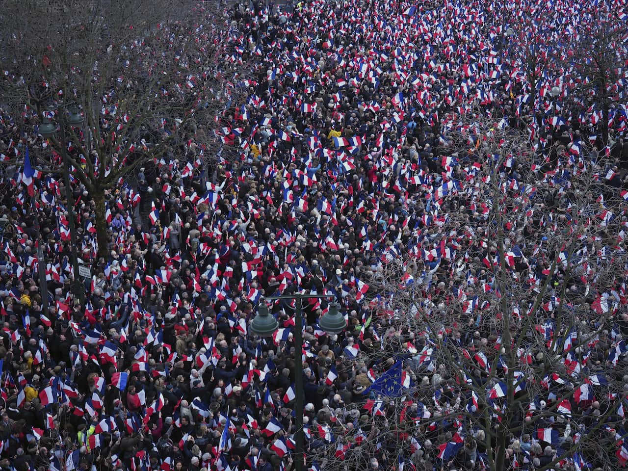 Supporters of conservative presidential candidate, Francois Fillon, listen during a rally in Paris on Sunday, March 5, 2017.