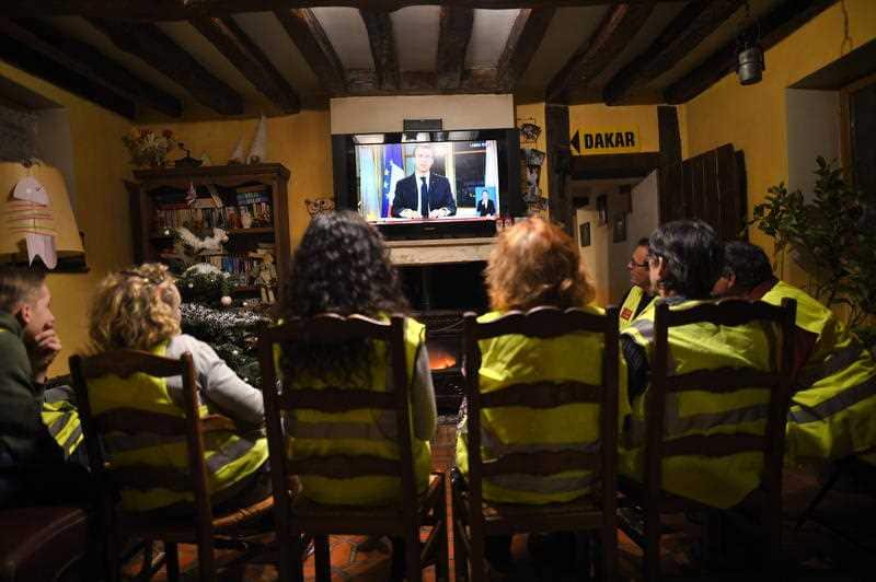 Yellow vests protesters are listening french president Emmanuel Macron speaking during a special address to the nation.