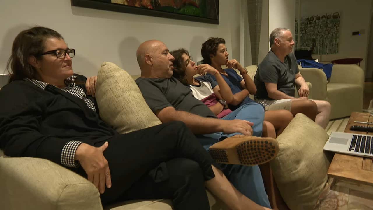 Dana, Frederic, Maxime and Arnaud Tartour, sitting with Patrick Benhamou