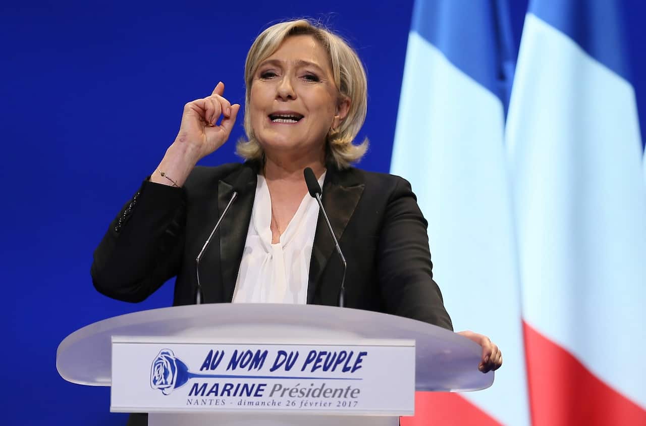 French Far-right leader presidential candidate Marine Le Pen gestures as she speaks during a conference in Nantes, western France, Sunday, Feb. 26, 2017.