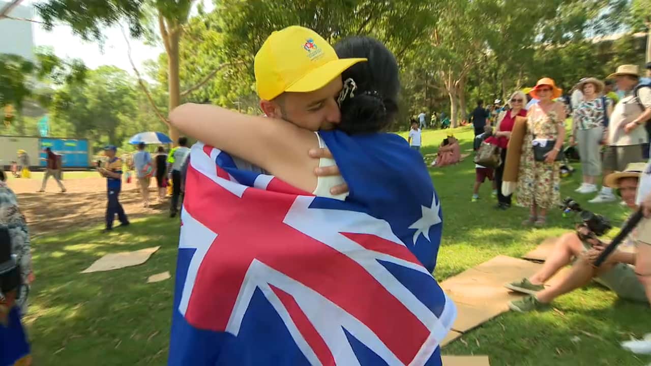 Martin Alato embraces his new wife.
