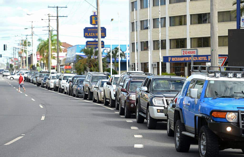 Residents queue for fuel at one of the two petrol stations open, as power is cut in most of the northern Queensland town of Rockhampton in February 2015. 
