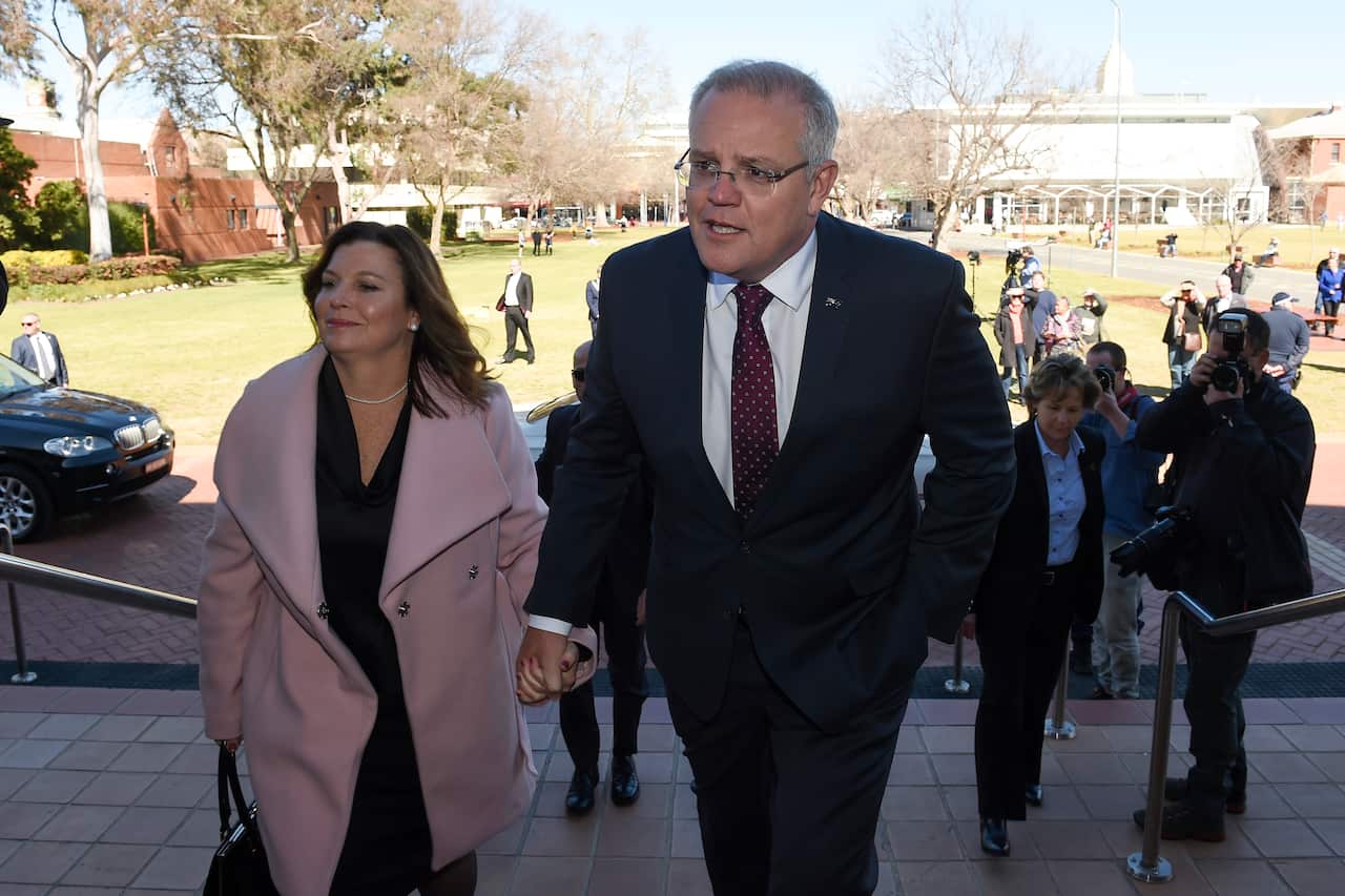 Prime Minister Scott Morrison and wife Jenny arrive for the State Funeral.