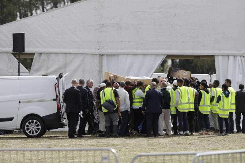 Mourners carry the body of a victim from the mosque shooting for burial at the Memorial Park Cemetery in Christchurch.