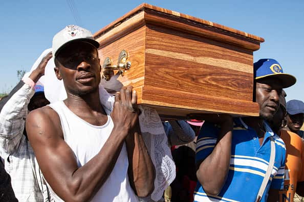 The funeral for Ishmael Kumire, 42, on August 4, in Chinamhora,. Ishmael was killed during deadly clashes between protesters and government forces